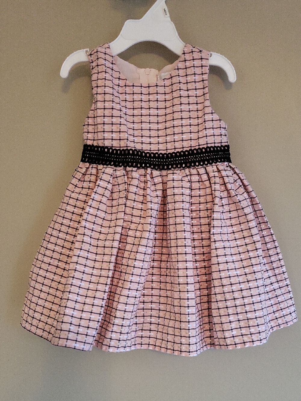 Pink check fit-and-flare dress with black waistband.